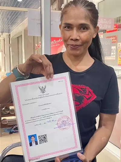 A graduate of Michael Thai Massage School holding their SorPorSor.14 practitioner registration, photo 1