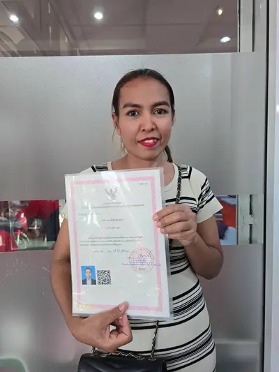 A graduate of Michael Thai Massage School holding their SorPorSor.14 practitioner registration, photo 3