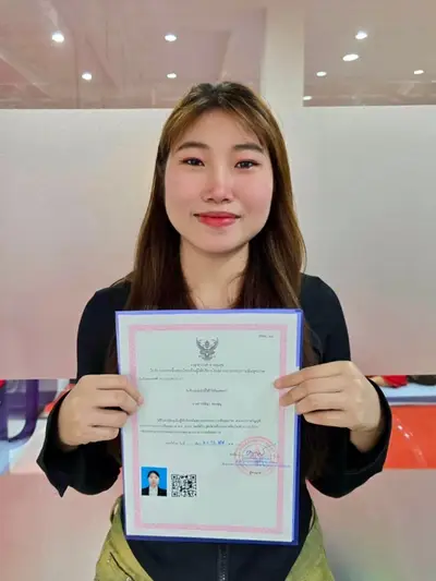 A graduate of Michael Thai Massage School holding their SorPorSor.14 practitioner registration, photo 5