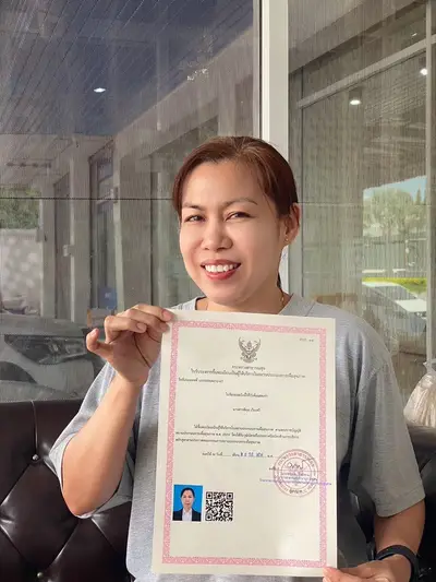A graduate of Michael Thai Massage School holding their SorPorSor.14 practitioner registration, photo 6